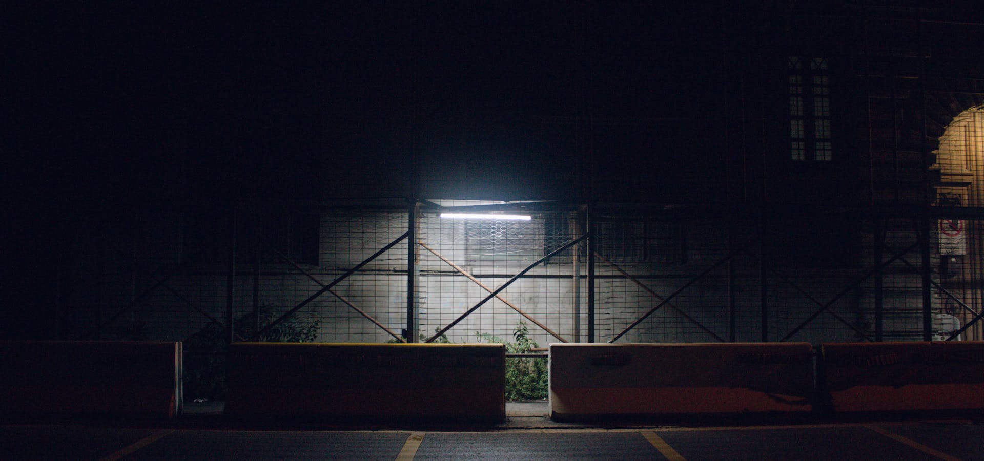 Industrial facility at night with dramatic lighting