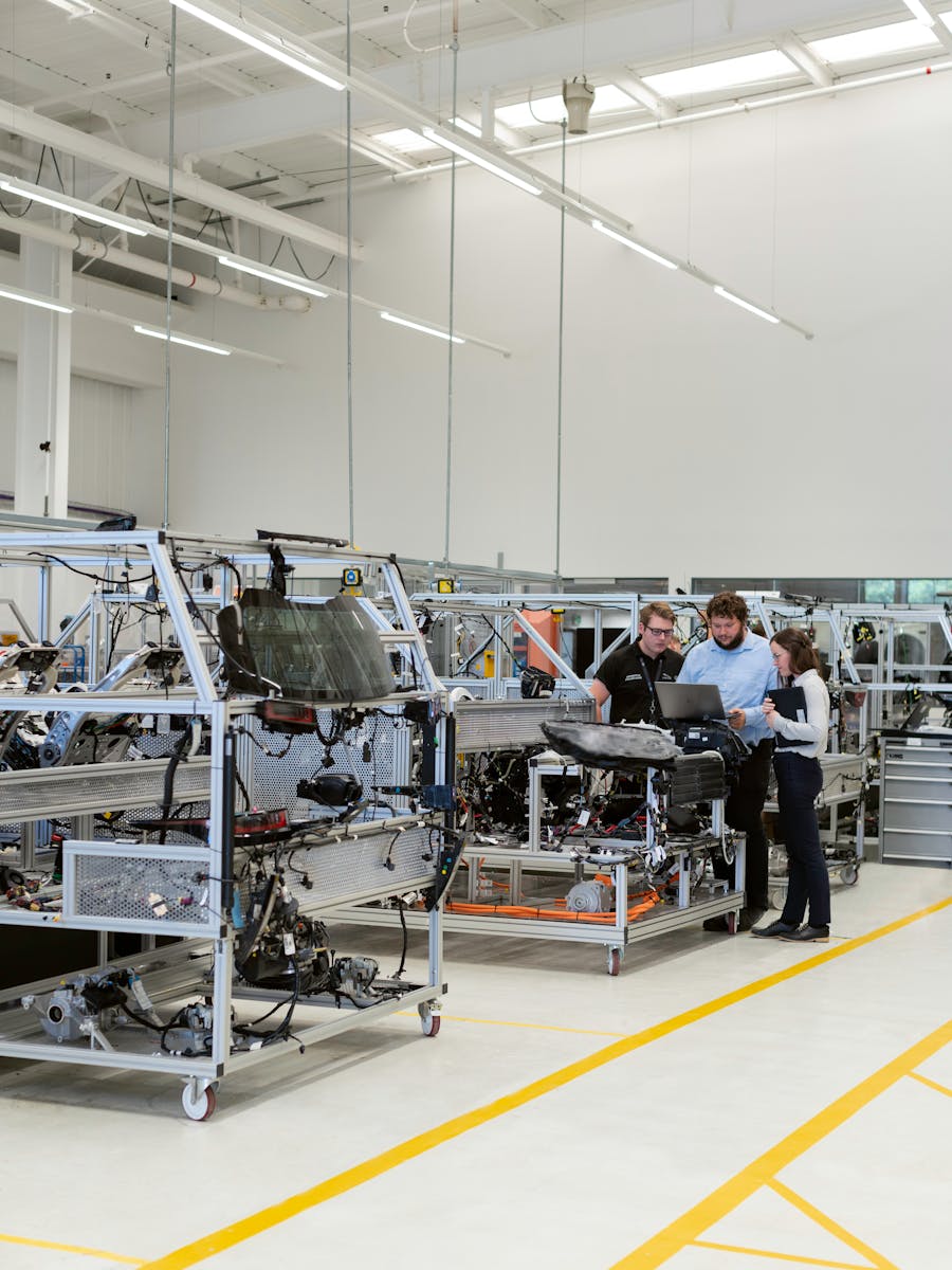Engineers on manufacturing assembly line