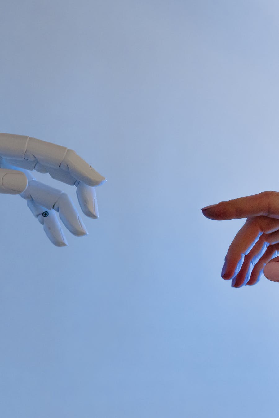 Human hand reaching toward robot hand — human-robot collaboration